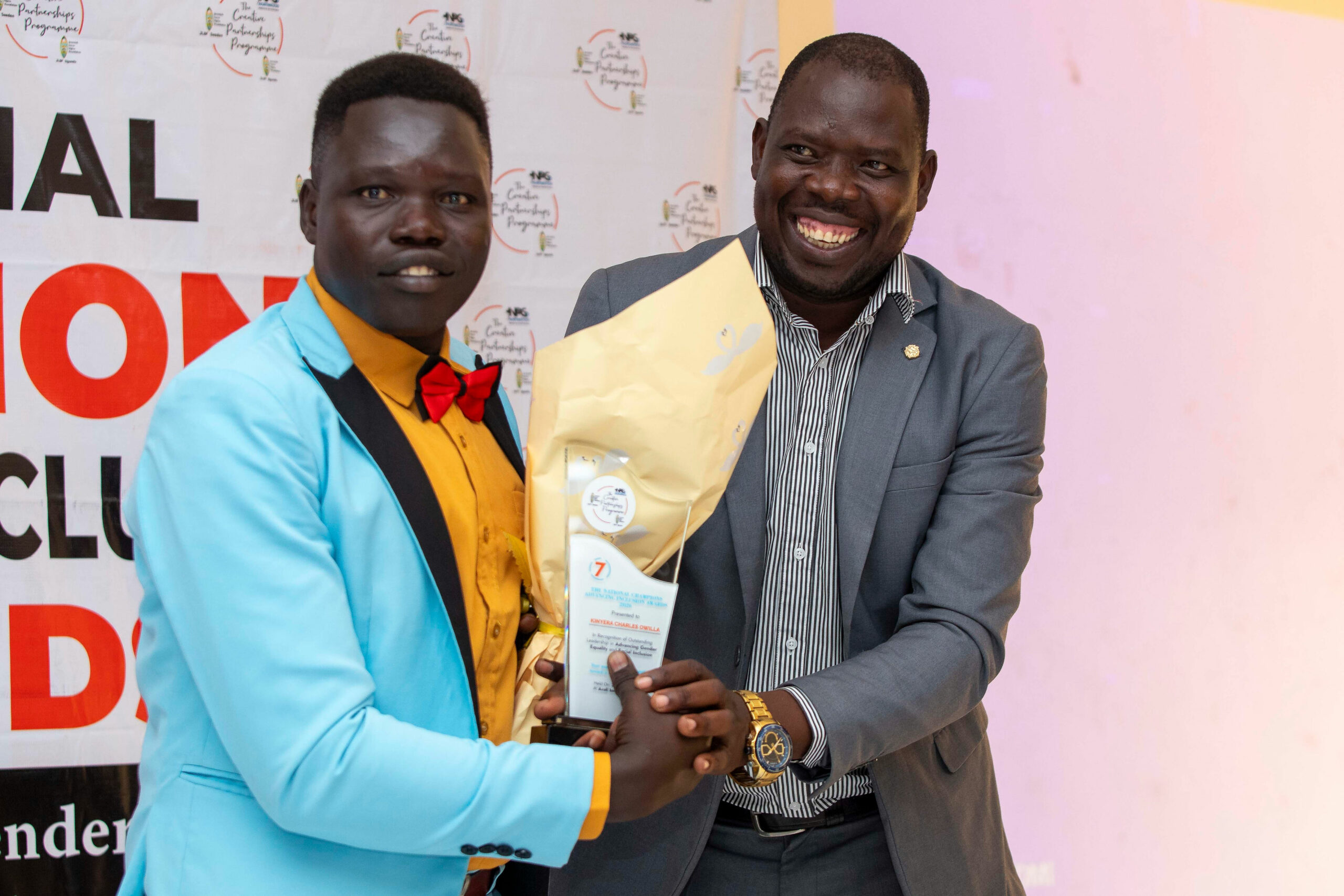 L-R: Winner Charles Owilla Kinyera, Hon. Okoya John Calvin